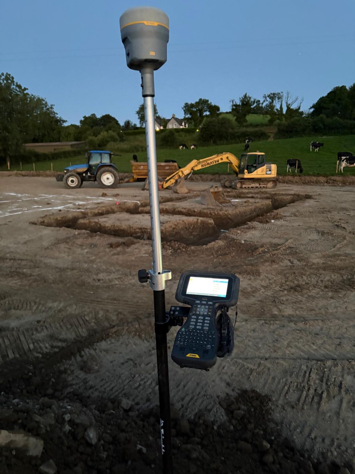 Surveying pole and controller set up on the cleared site
